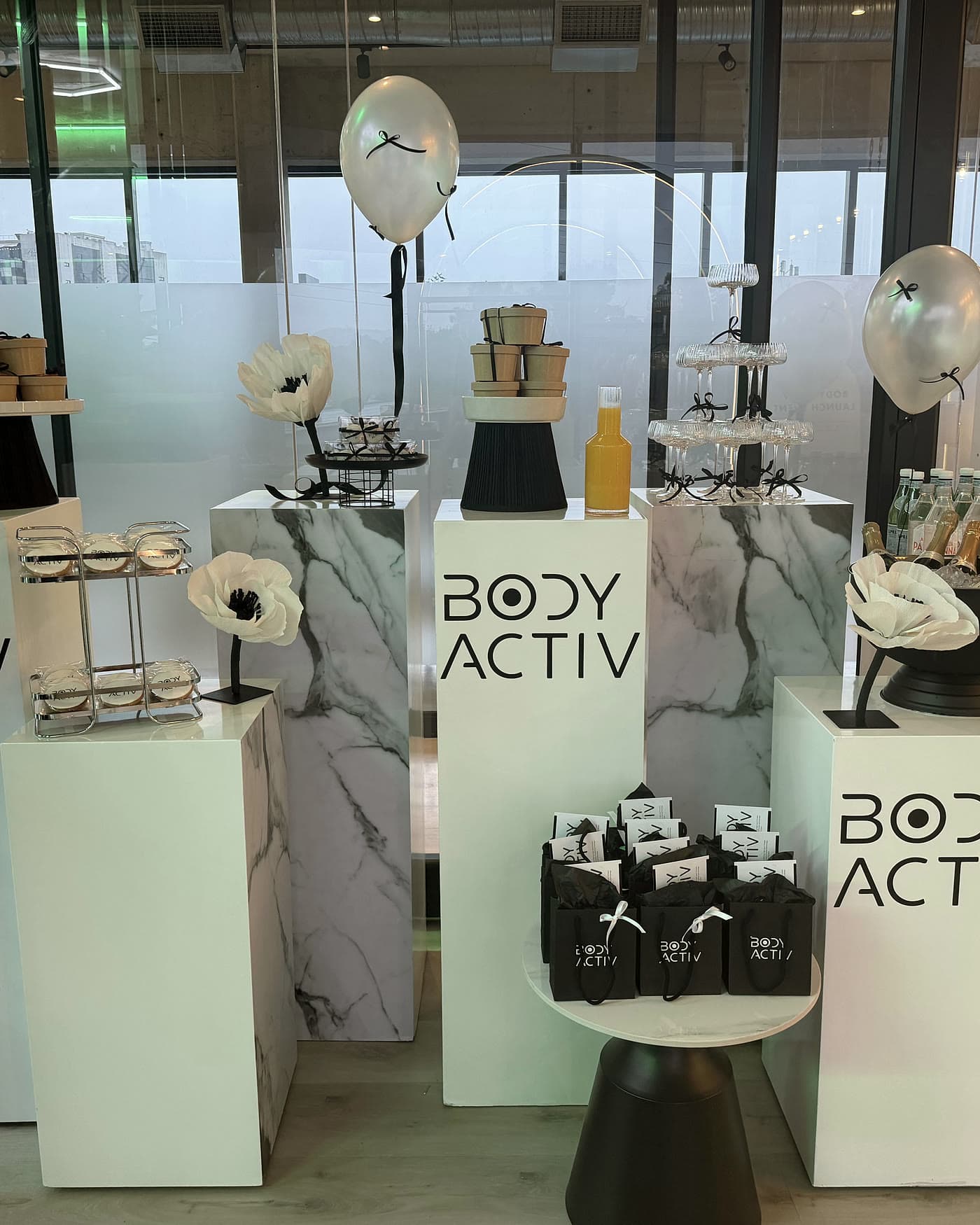 Body Activ product displayed on marble plinths